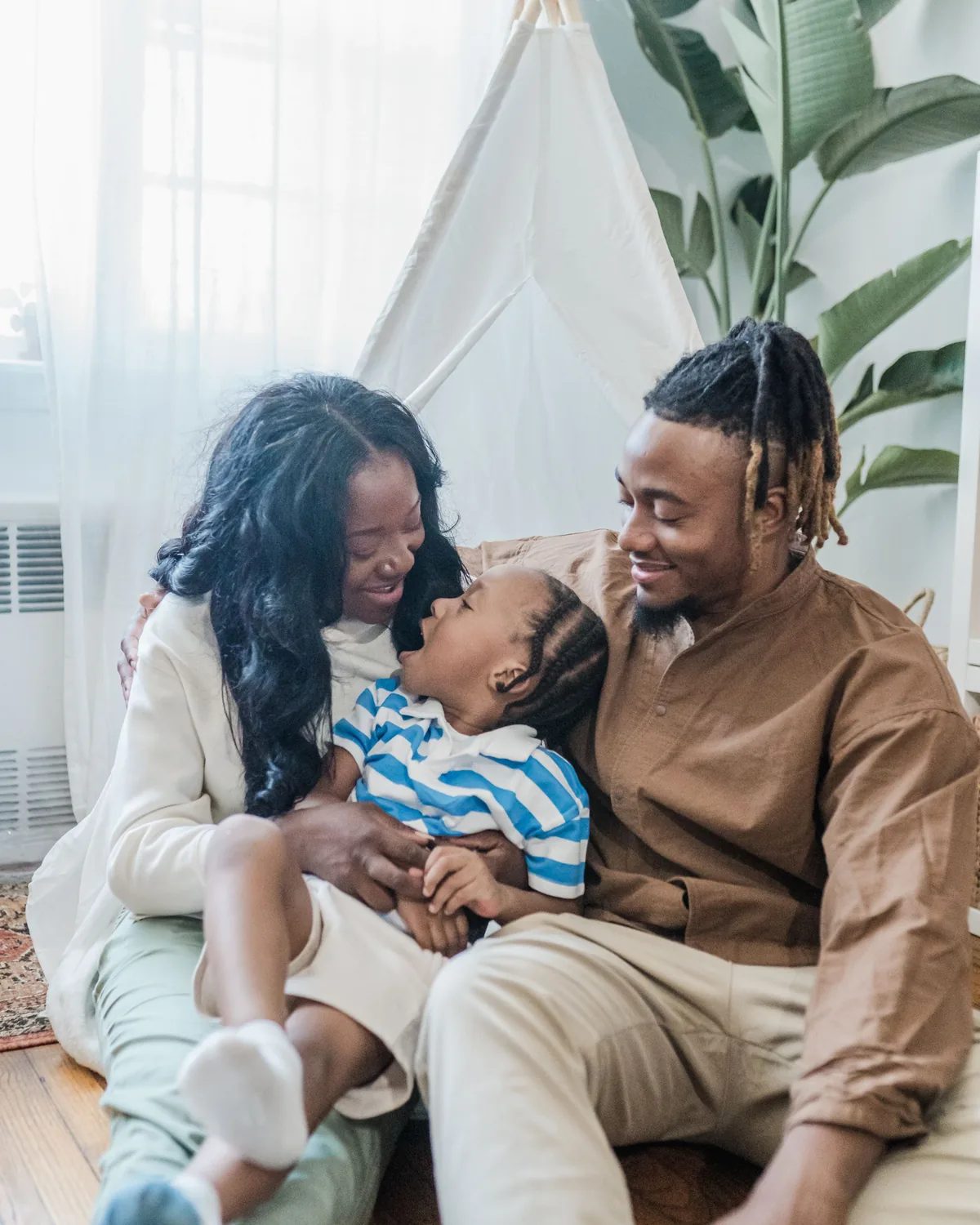 A family relaxing together in a bright, clean living room after mold remediation
