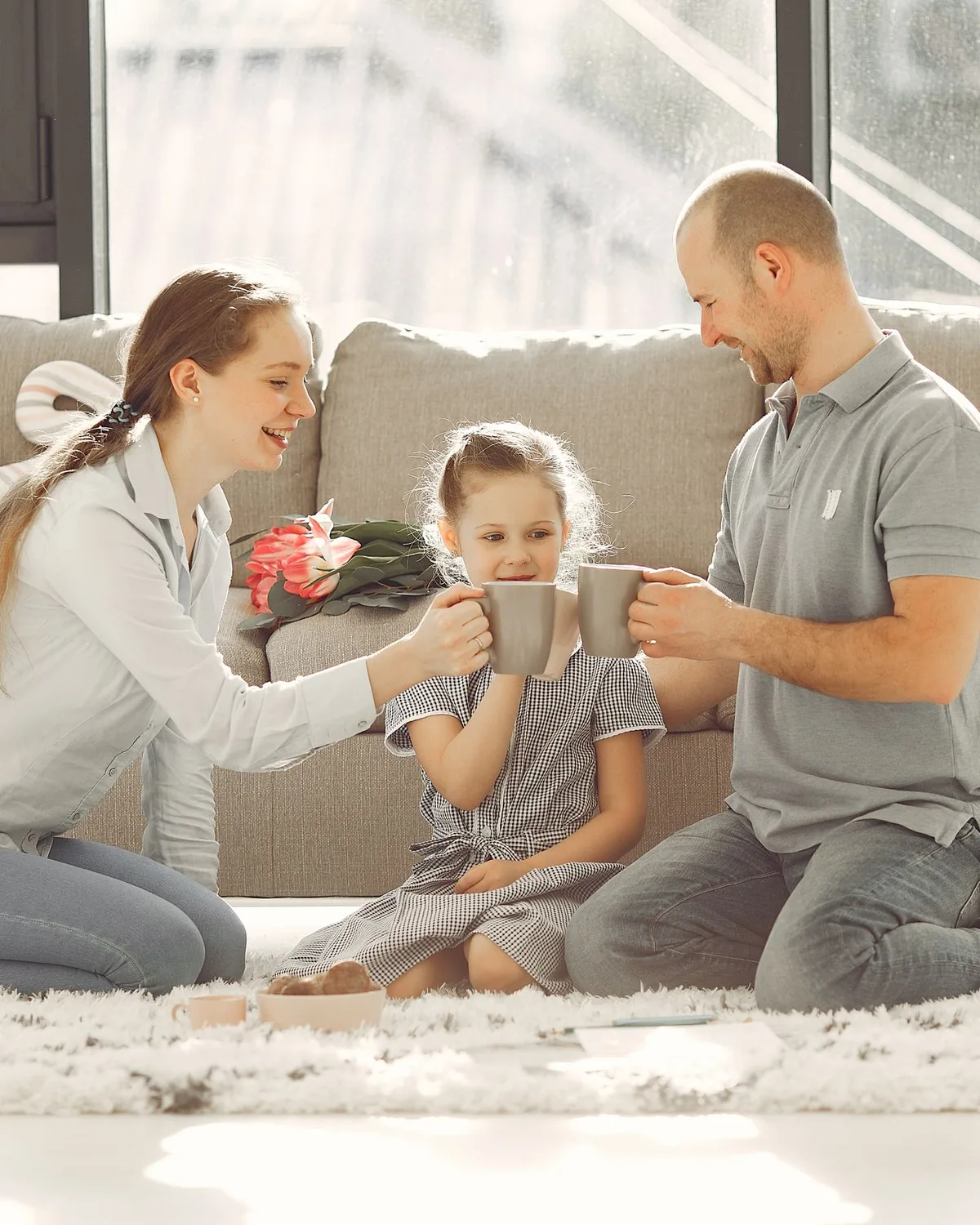 Parents and their daughter enjoying a bright, clean home